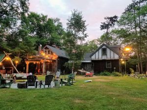 Installing landscape lighting dramatically improves curb appeal of this rural home