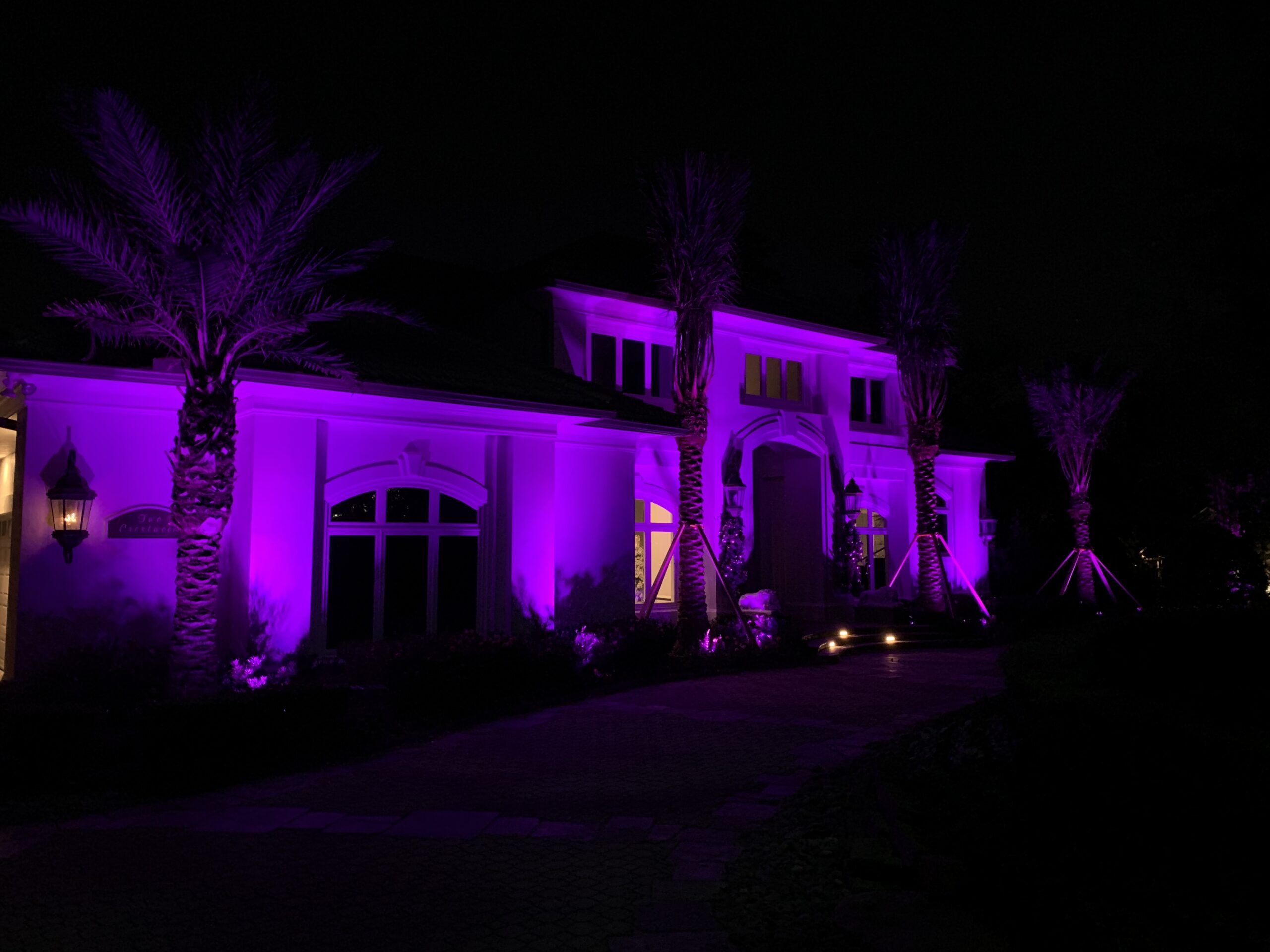Exterior of home illuminated with LED lights through Haven Lighting