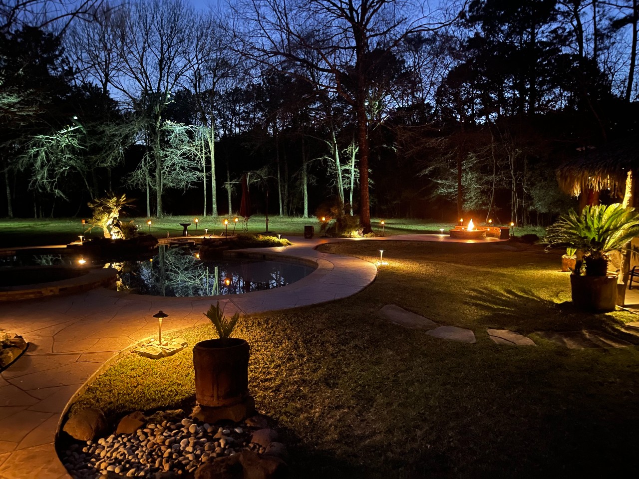 Outdoor Lighting Illuminates Backyard walkway in the evening