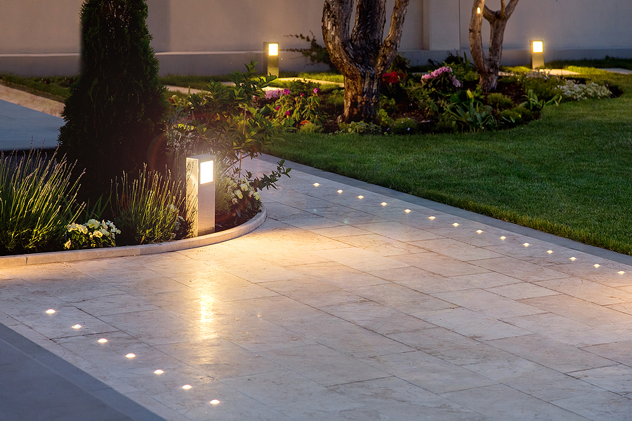 In-ground lighting illuminates walkway at night