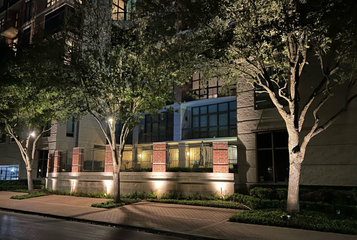 Outdoor lighting illuminates apartment exterior