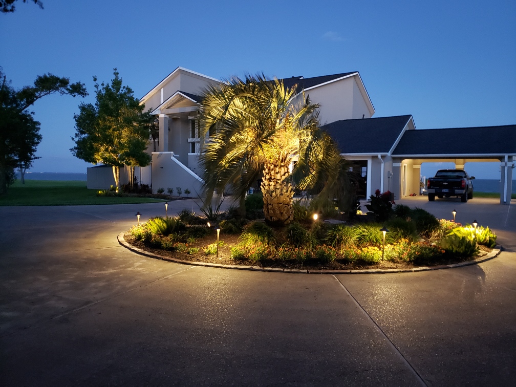 Outdoor lighting on circular driveway in front of house