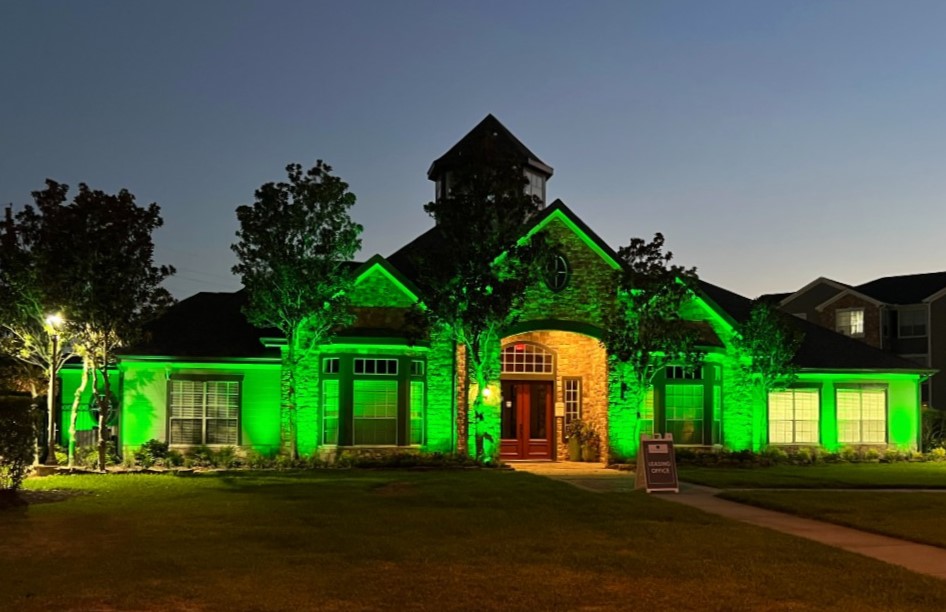 Home illuminated with green lighting for the harvest season.