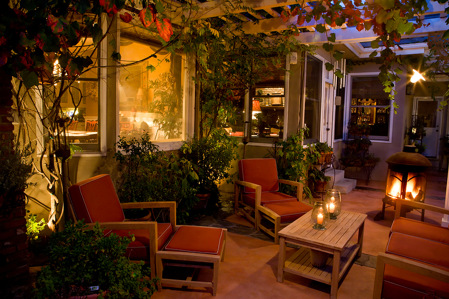 Back patio prepared with a comfortable lounge area for a staycation feel at home. 