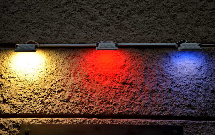 Low-angle LED illumination showcasing new lighting trends on the facade of a historic building at night.