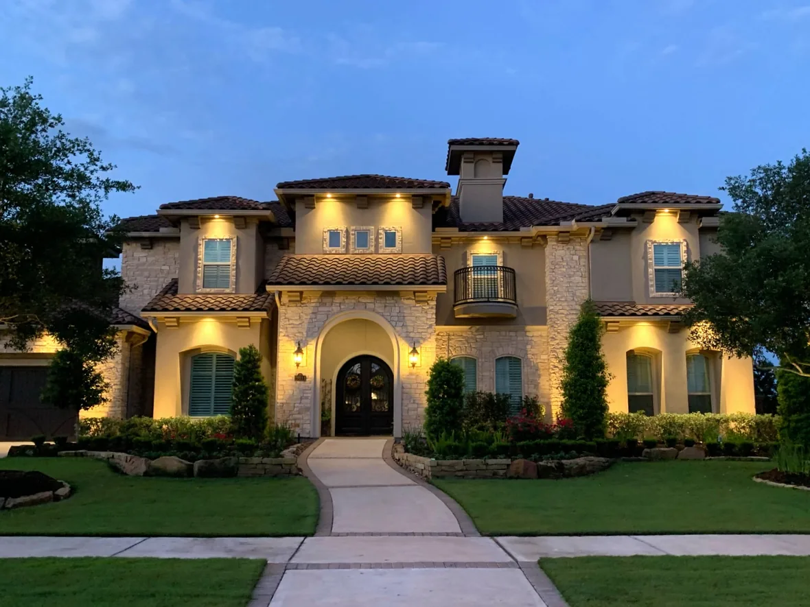 hl-arch-grazing-brick-1180.webp Brick and stone elevation grazed from close range so the texture of the masonry reads at night