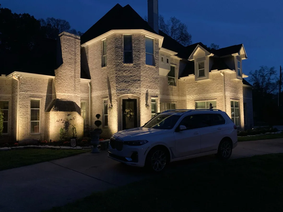House elevation and planting lit with warm LED after an upgrade